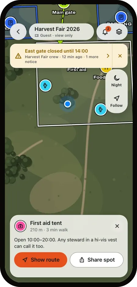 The guest map with the first aid tent selected: 210 m, a 3 minute walk, with Show route and Share spot.